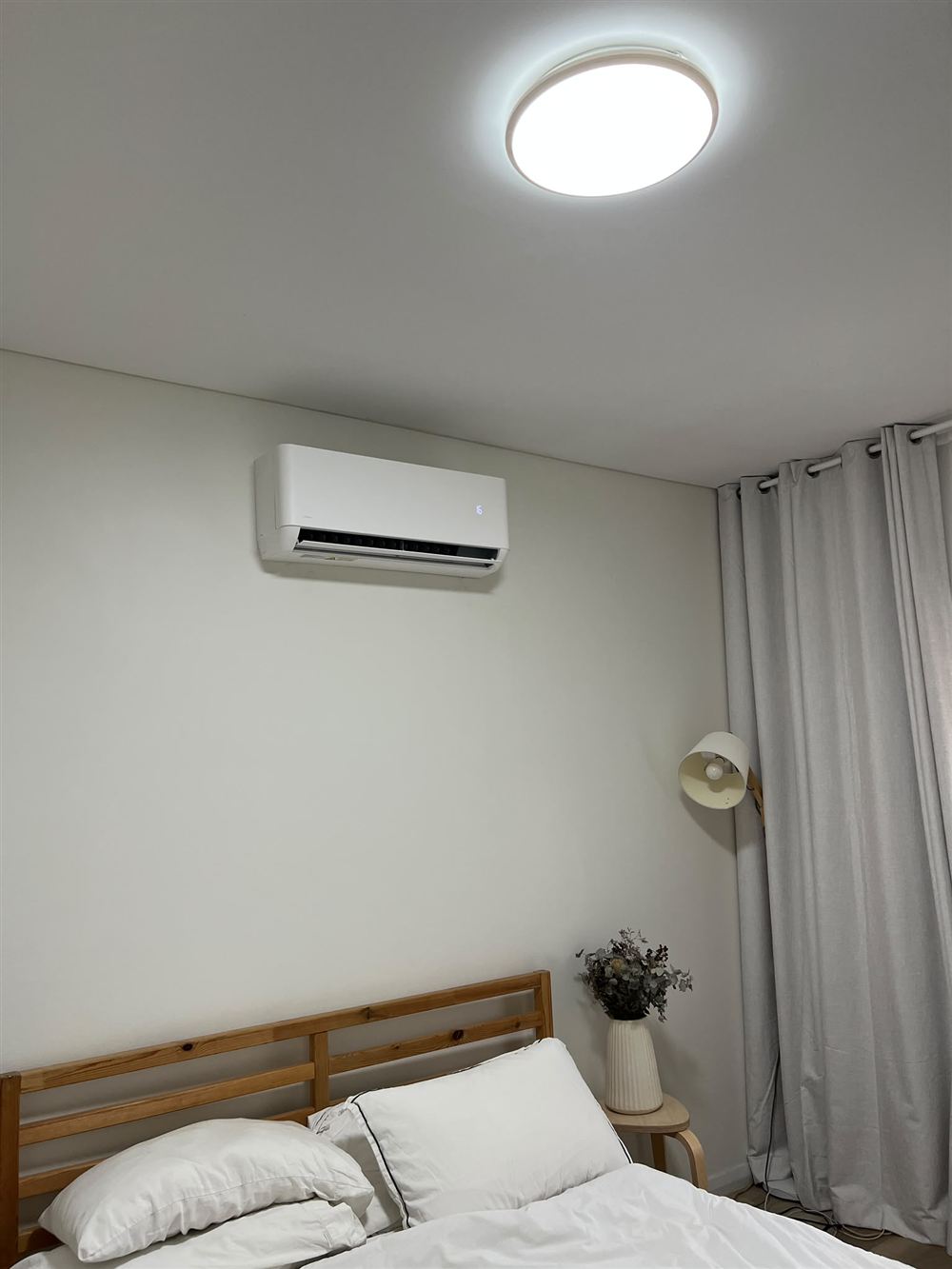 Split system air conditioner mounted on a bedroom wall